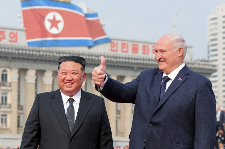 Kim and Lukashenko shake hands in Pyongyang