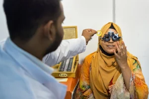 Garment worker wearing affordable glasses