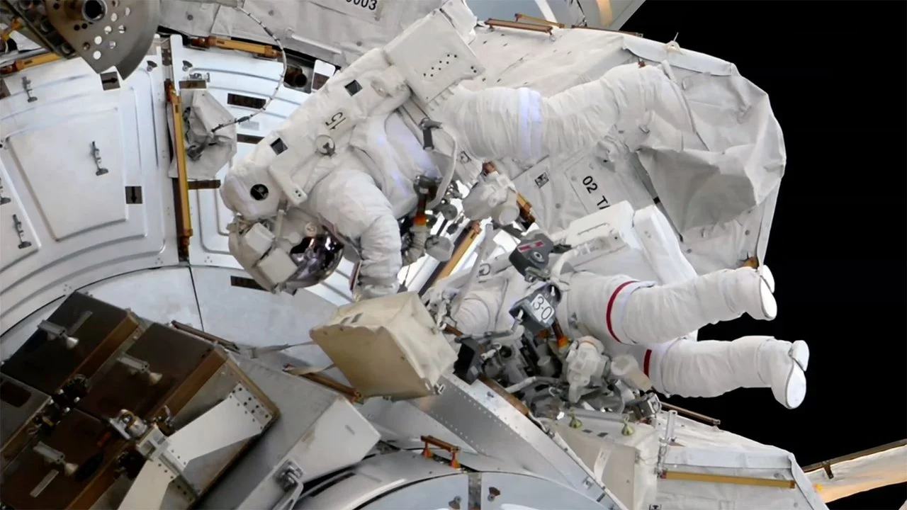 All-Female Spacewalk: Astronauts Swap ISS Docking Reflector and Camera in Historic EVA