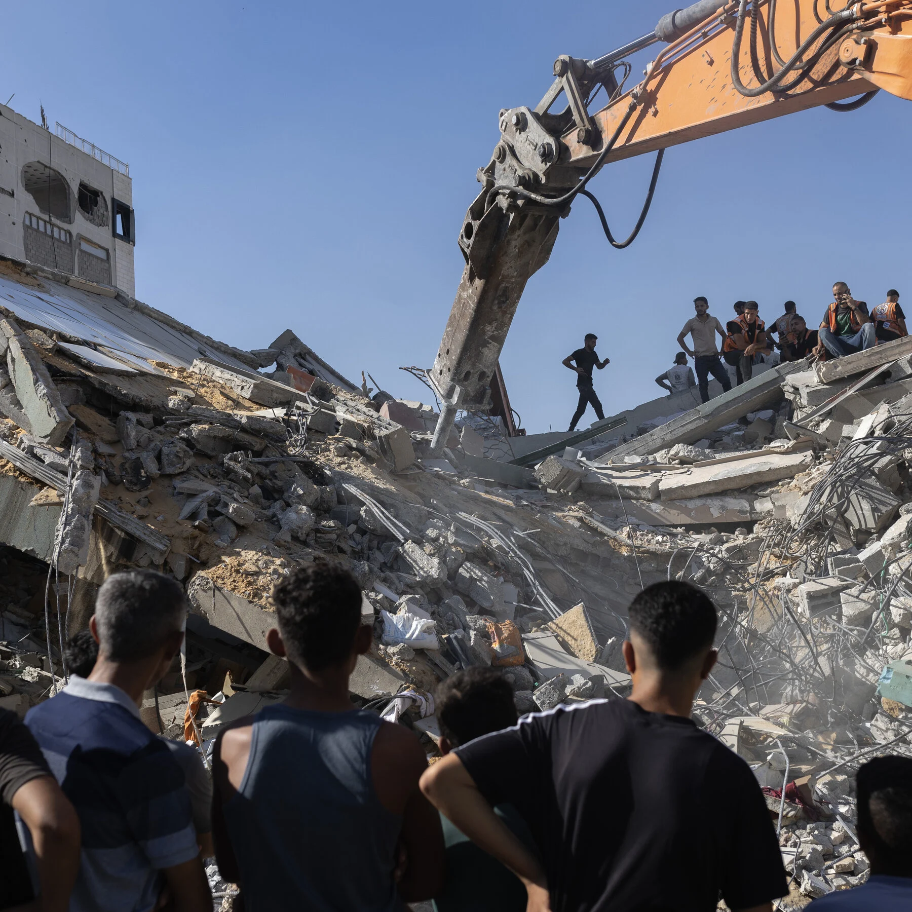 Gaza building collapse leaves at least 21 dead, Israel denies strike